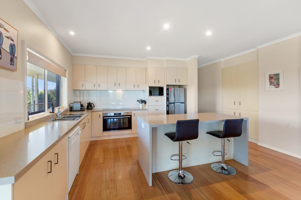 Kitchen or kitchenette, dishwasher, oven, stove
