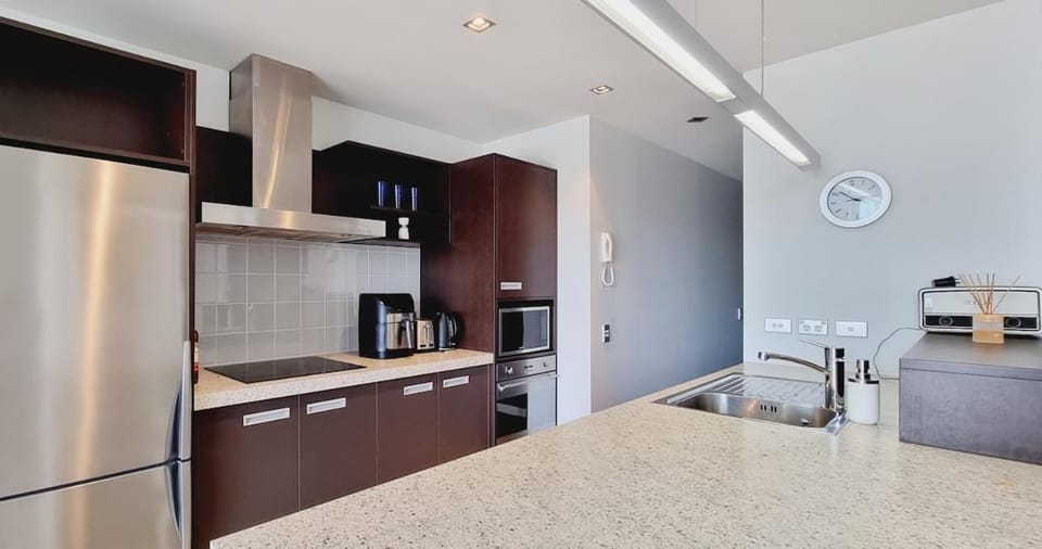 Kitchen or kitchenette, dishwasher, oven, stove, toaster