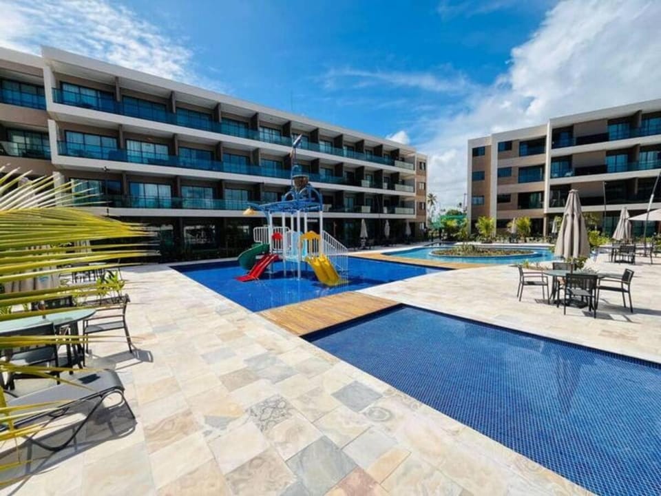 Property building, Patio, Communal lounge/ TV room, Day, Children play ground, Aqua park, Evening entertainment, Pool view, Swimming pool, sunbed