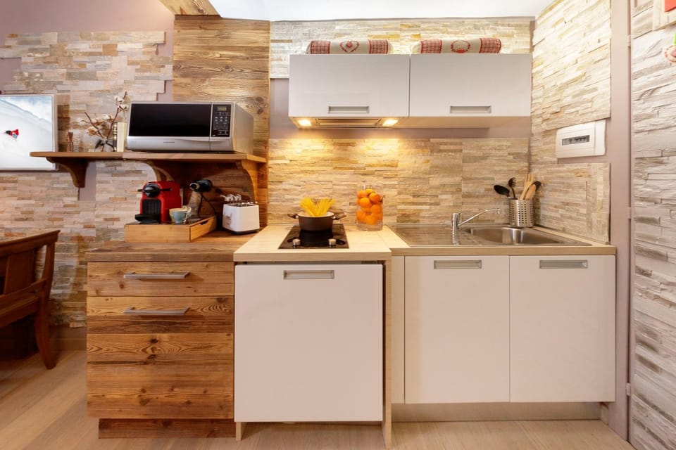 Kitchen or kitchenette, microwave, stove, toaster