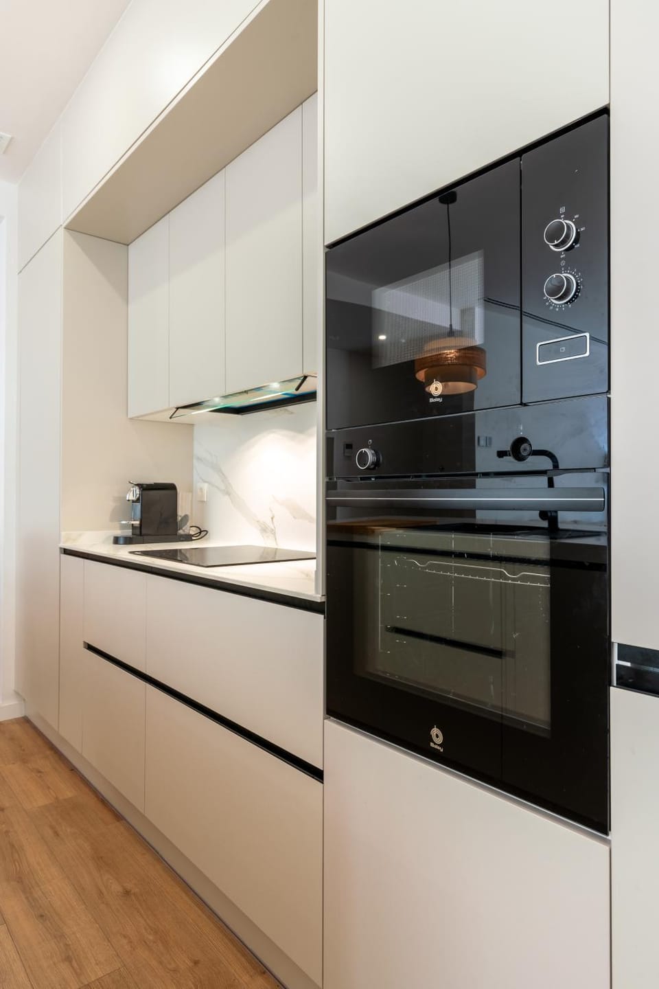 Kitchen or kitchenette, dishwasher, oven, stove