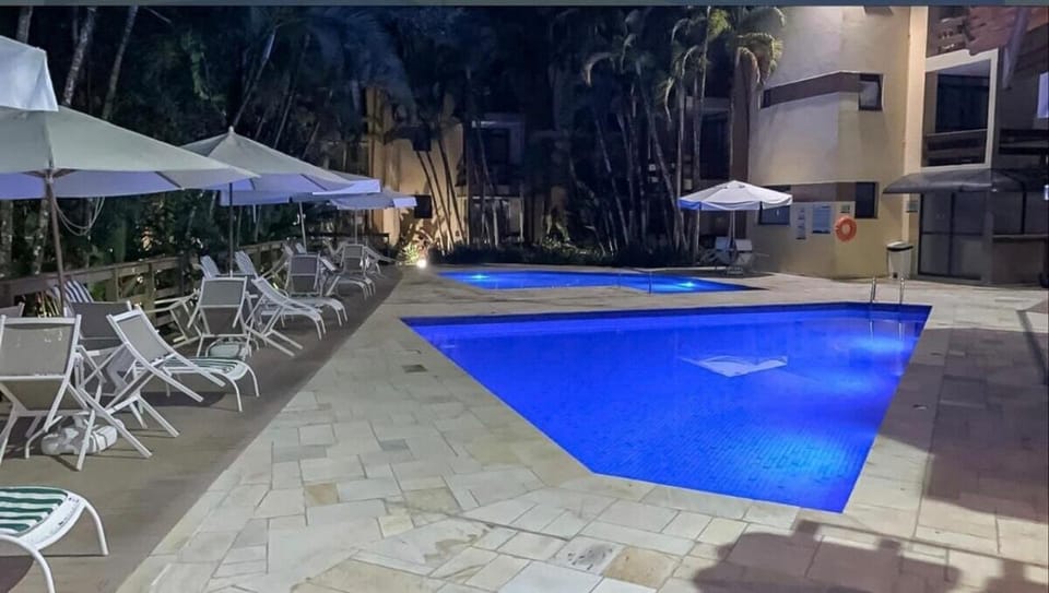 Apartamento em Riviera de São Lourenço com piscina aquecida e serviço de arrumação Apartment in Bertioga