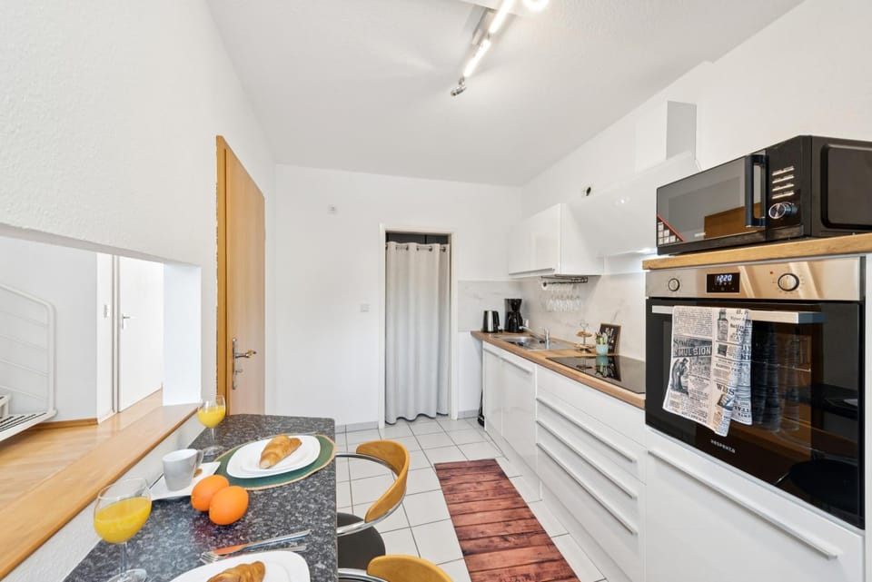 Kitchen or kitchenette, Dining area, dishwasher, furniture, microwave, oven, stove, toaster, kitchen