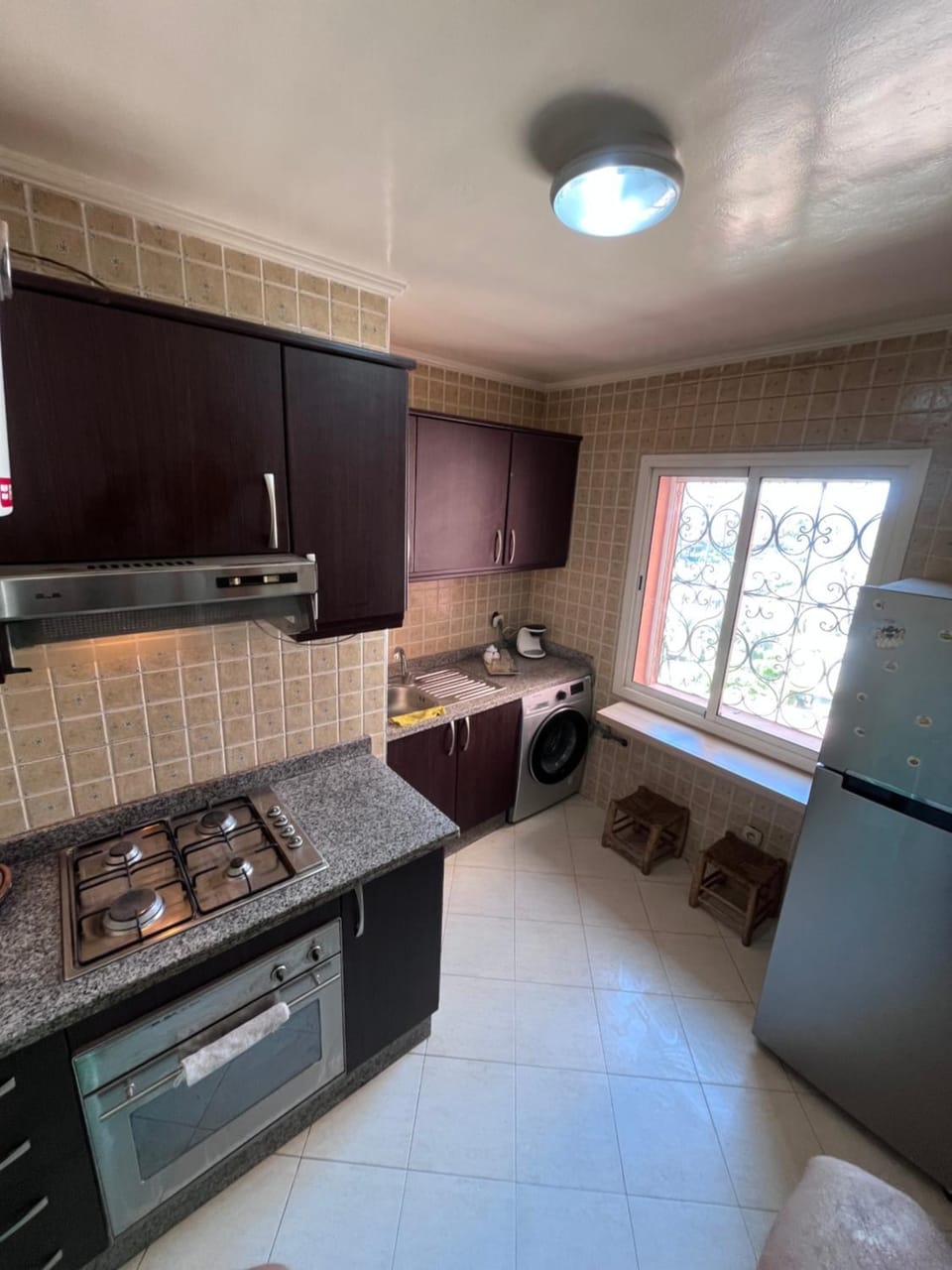 Kitchen or kitchenette, dishwasher, oven, stove