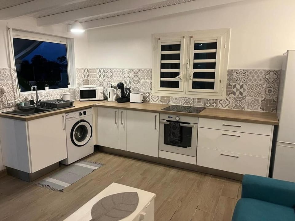 Kitchen or kitchenette, dishwasher, oven, stove, toaster, washing machine, dryer