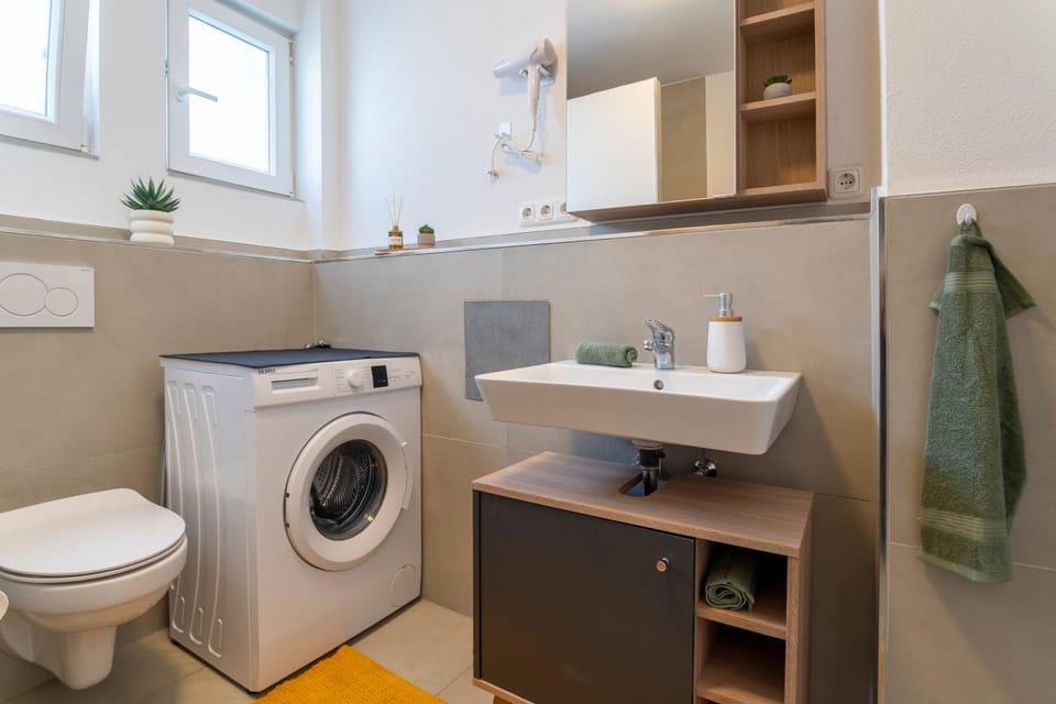 Toilet, Bathroom, towels, washing machine, dryer