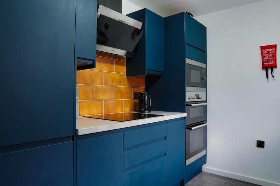Kitchen or kitchenette, dishwasher, oven, stove