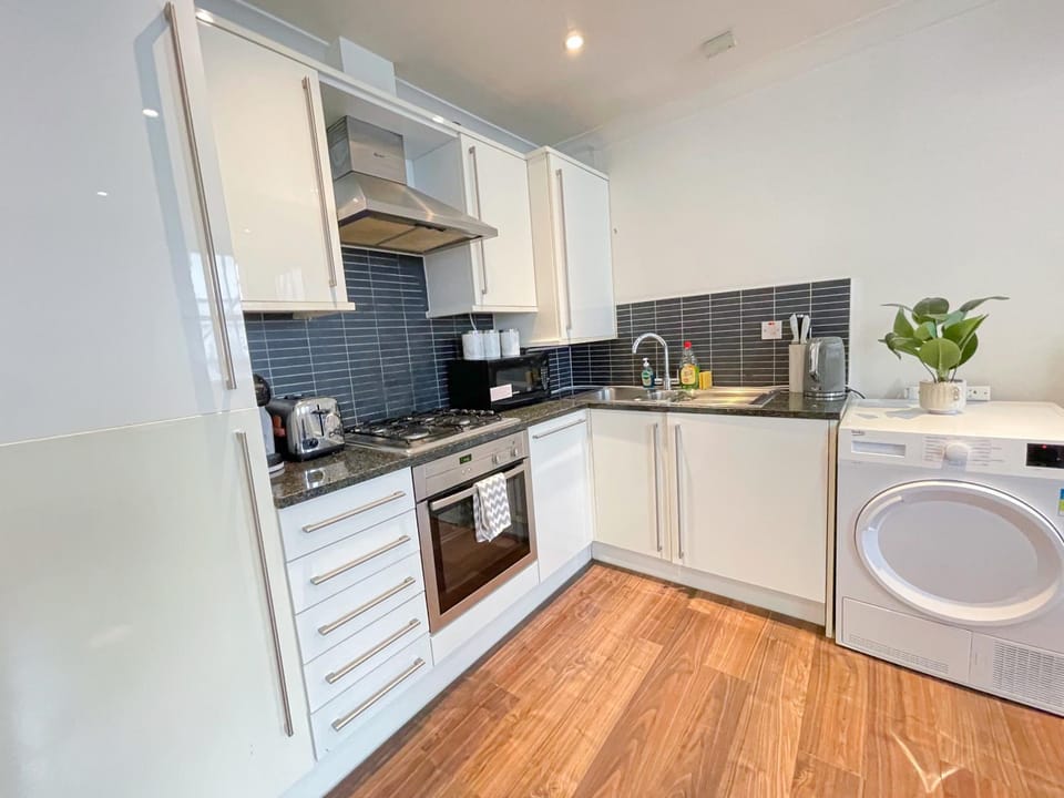 Coffee/tea facilities, dishwasher, microwave, oven, storage, stove, toaster, washing machine, dryer, kitchen