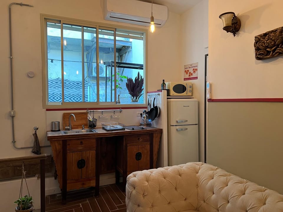 Kitchen or kitchenette, stove, air conditioner
