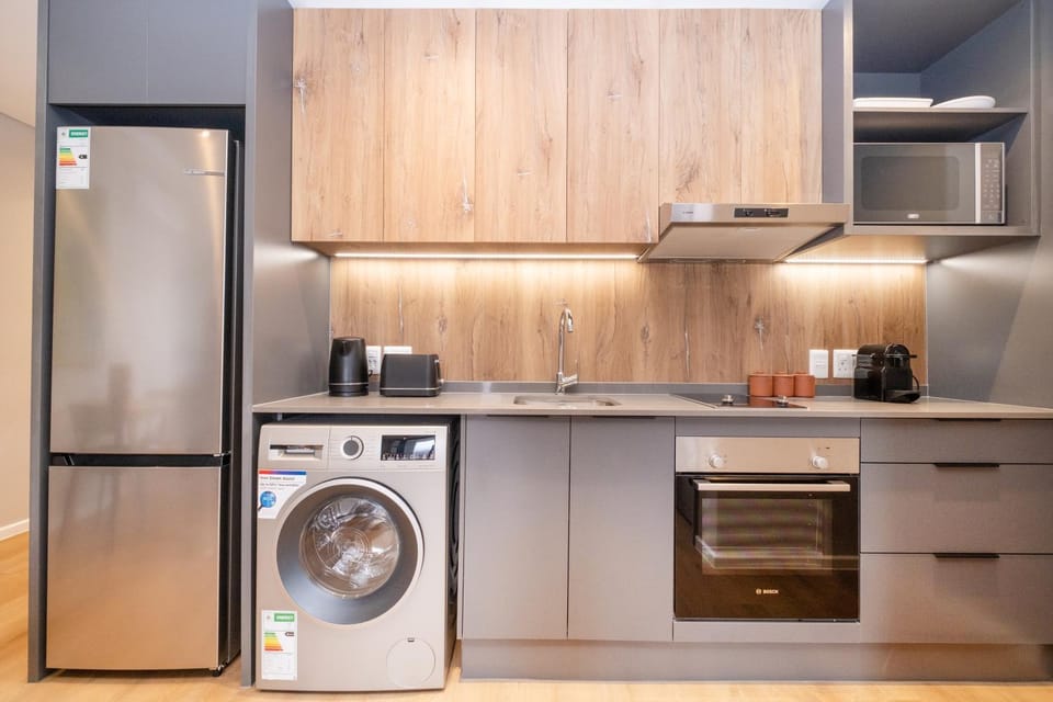 Coffee/tea facilities, Kitchen or kitchenette, microwave, oven, stove, toaster, washing machine