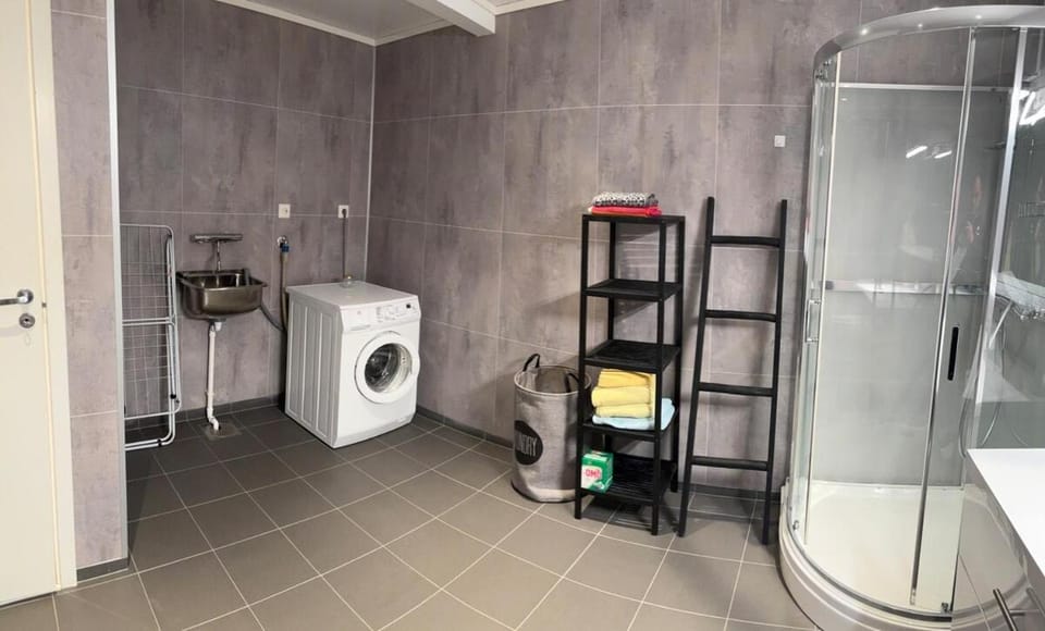 Shower, Toilet, Bathroom, towels, washing machine, dryer