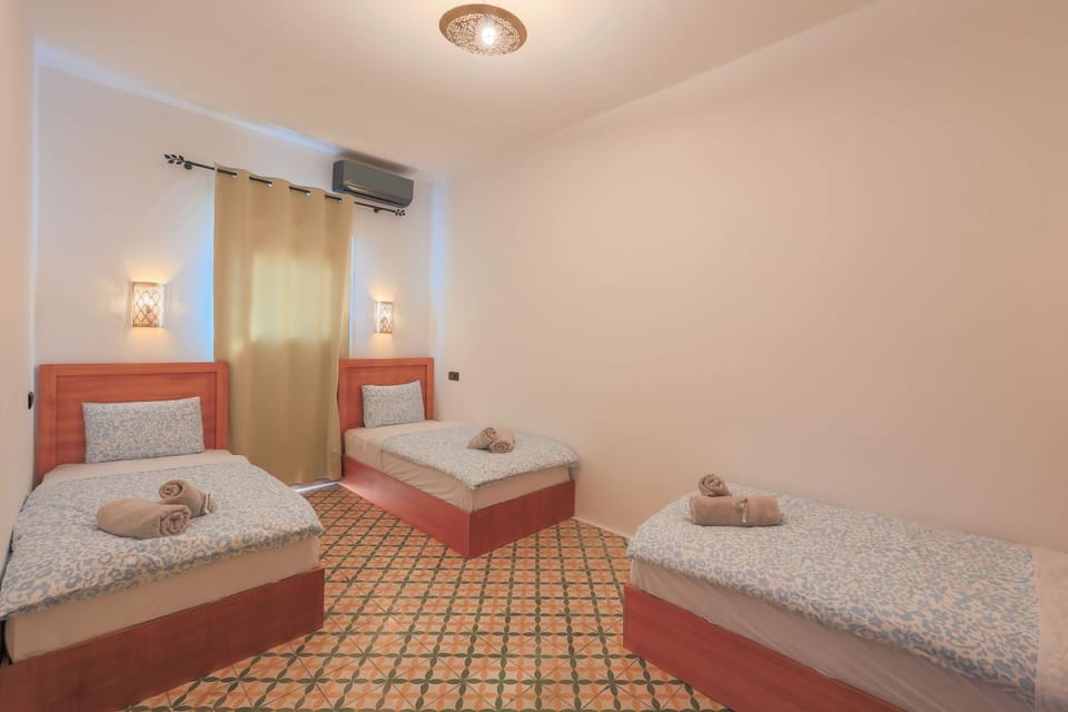 Photo of the whole room, Bedroom, towels, air conditioner