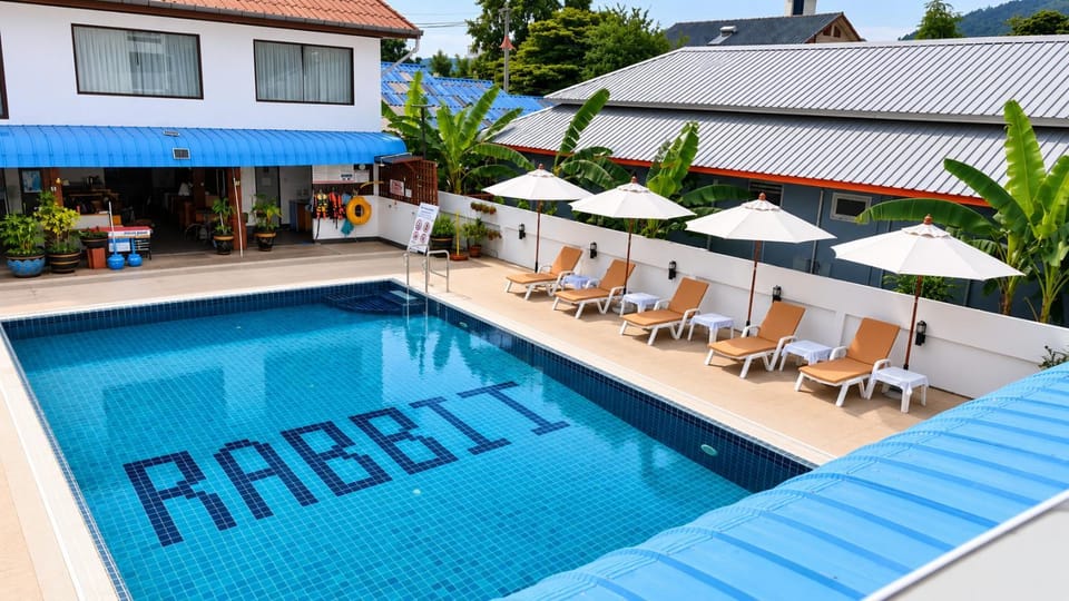 Property building, Patio, Pool view, Swimming pool, sunbed