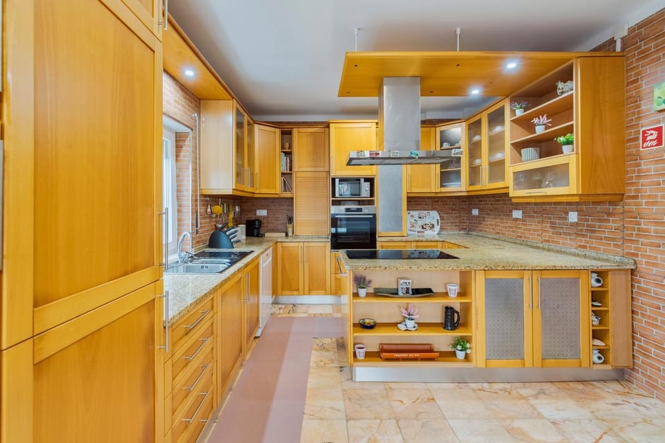 Kitchen or kitchenette, dishwasher, microwave, oven, stove, toaster