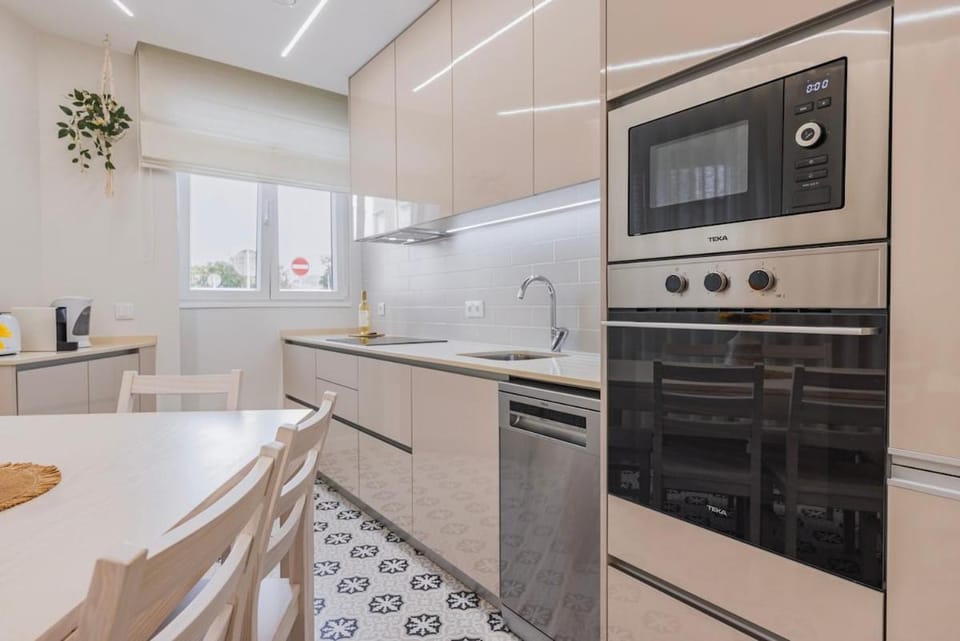 Kitchen or kitchenette, dishwasher, oven, stove, toaster