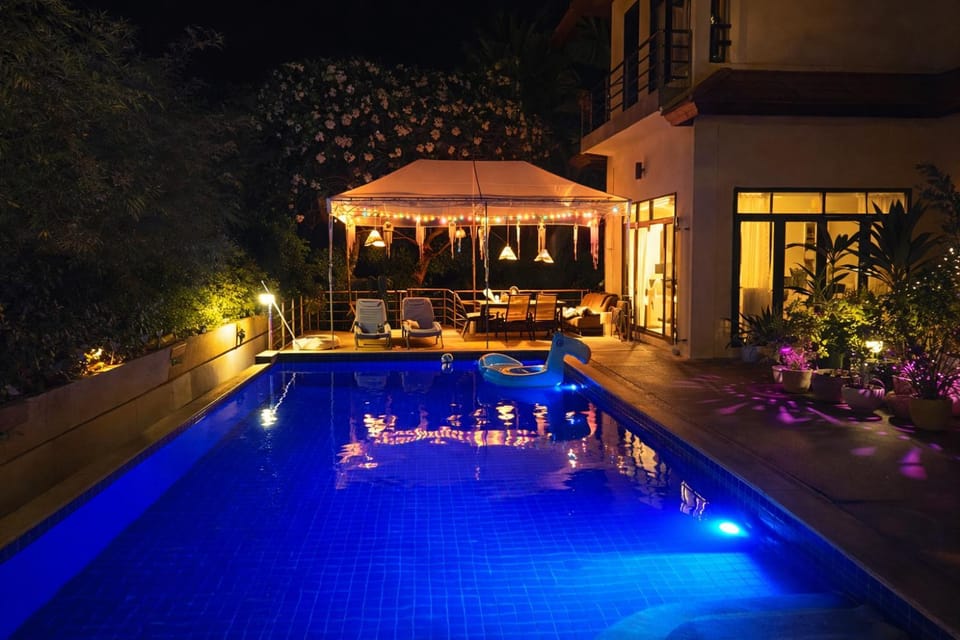 Patio, Night, Pool view, Swimming pool, sunbed