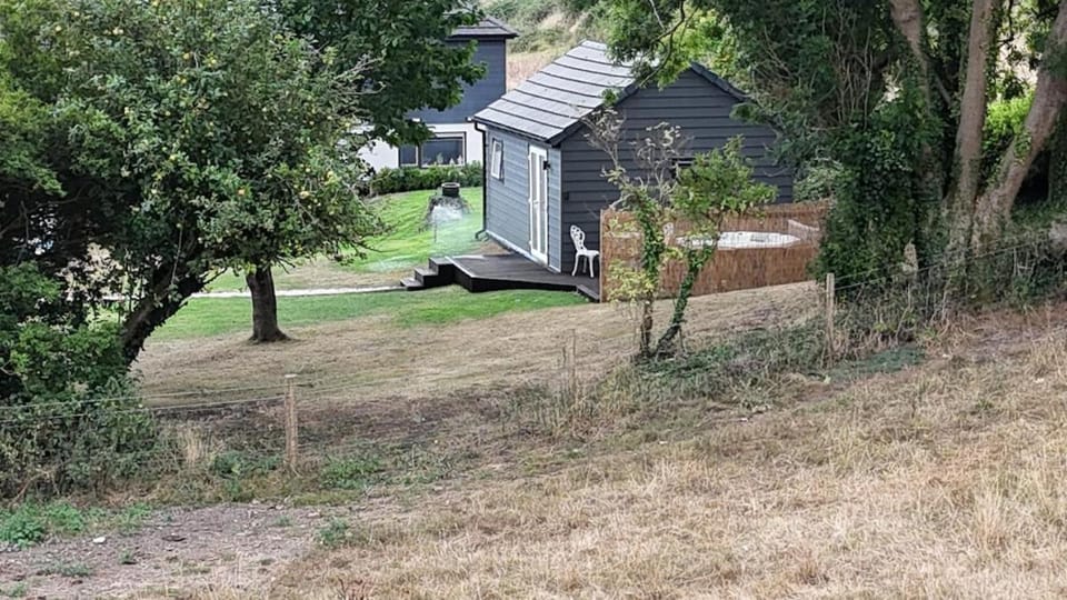 The Pumphouse with Hot Tub Chalet in West Dorset District