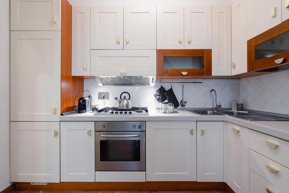 Kitchen or kitchenette, dishwasher, oven, stove, toaster