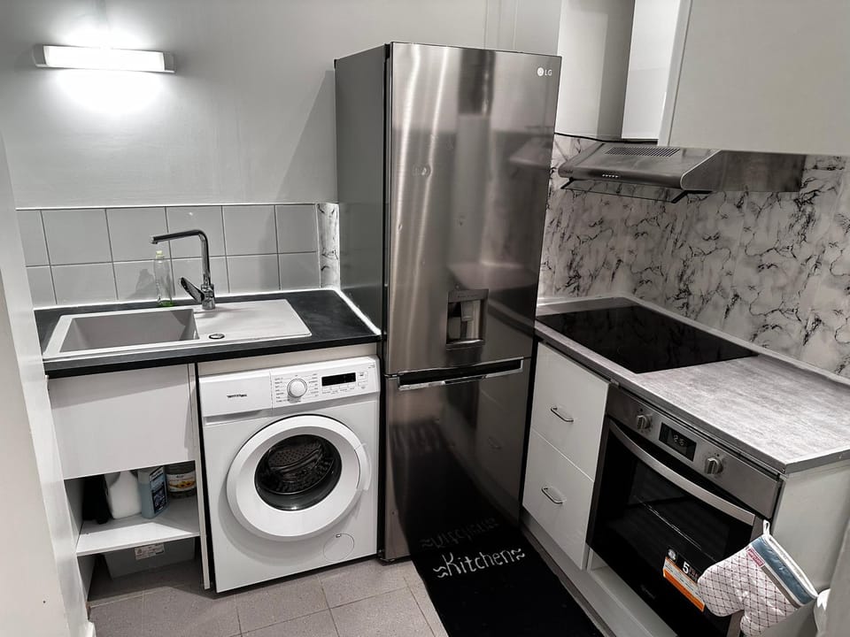 Kitchen or kitchenette, dishwasher, oven, toaster, washing machine, dryer, kitchen