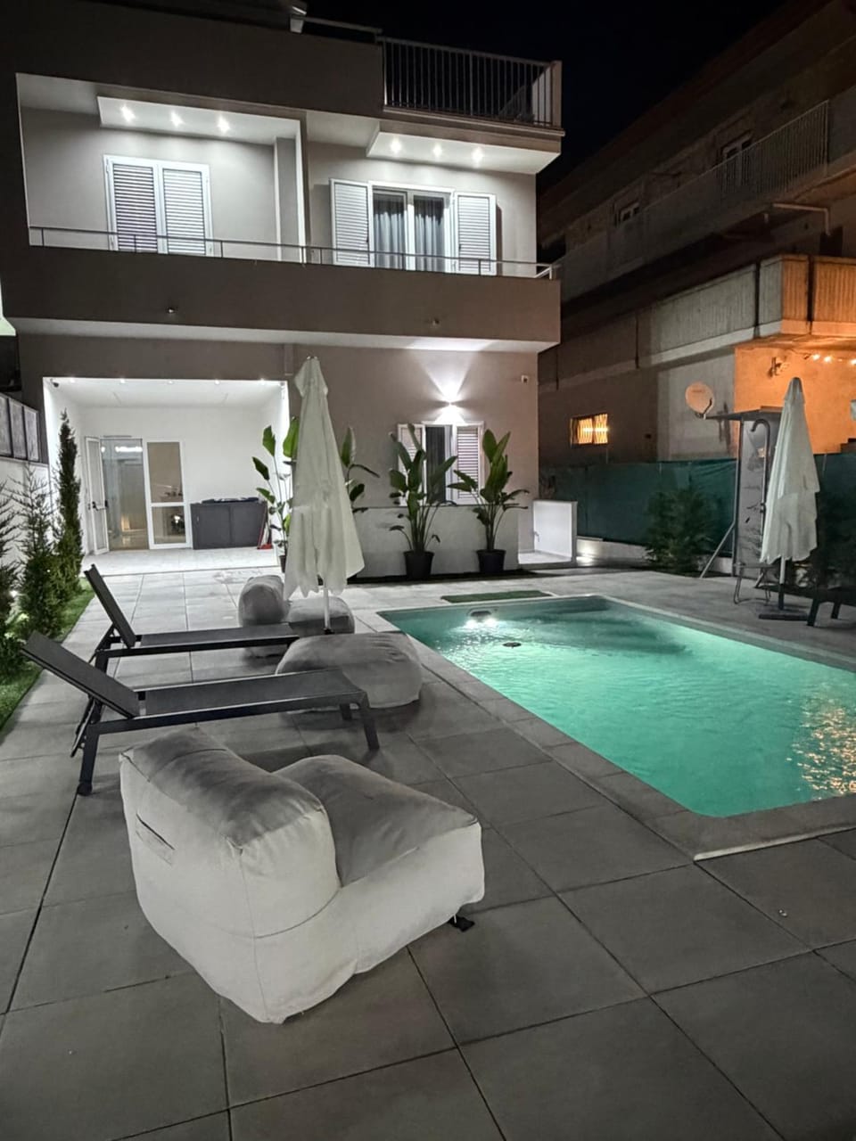 Property building, Night, Pool view, Swimming pool, sunbed