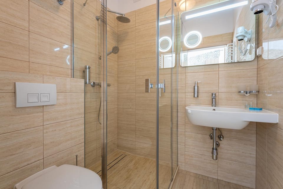 Shower, Toilet, Bathroom, hair dryier, towels