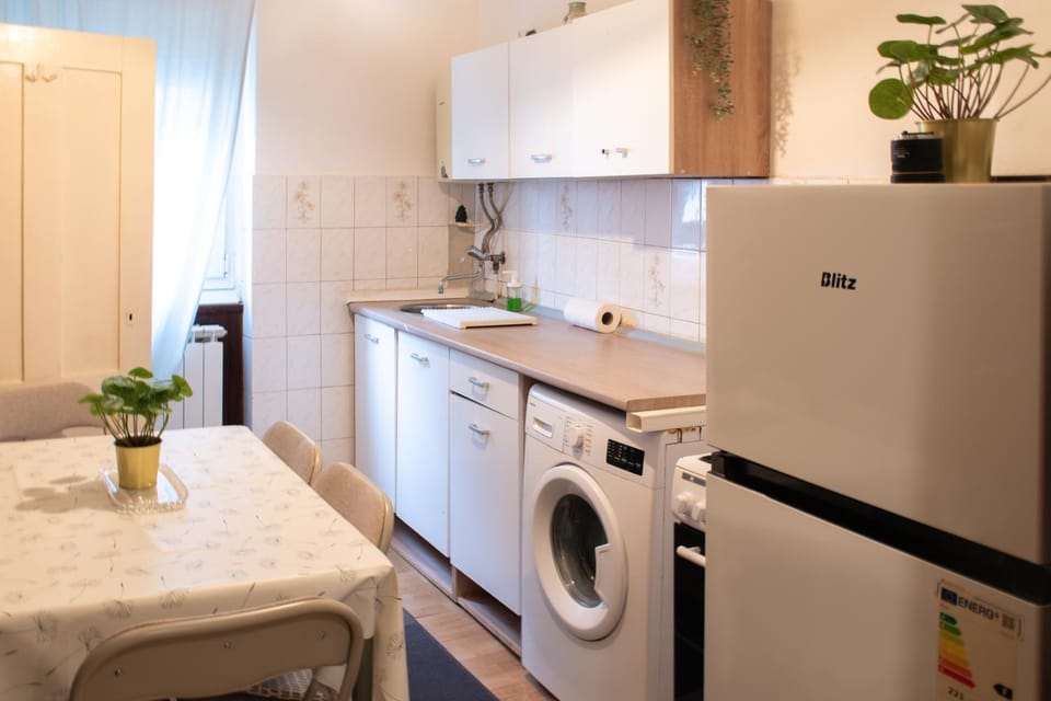 Kitchen or kitchenette, stove, washing machine