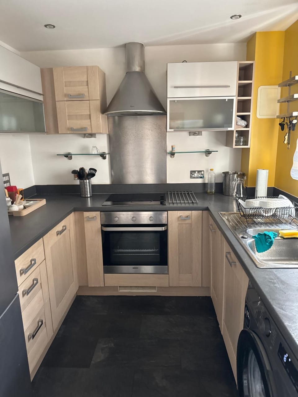 Kitchen or kitchenette, dishwasher, oven, stove