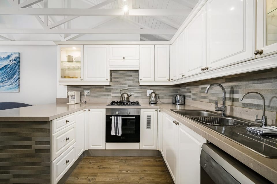 Kitchen or kitchenette, dishwasher, oven, stove, toaster