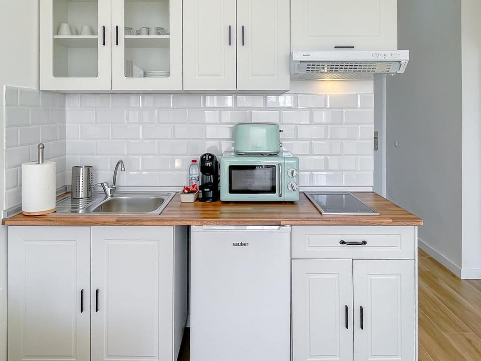 microwave, stove, stove, toaster, kitchen, kitchen, air conditioner