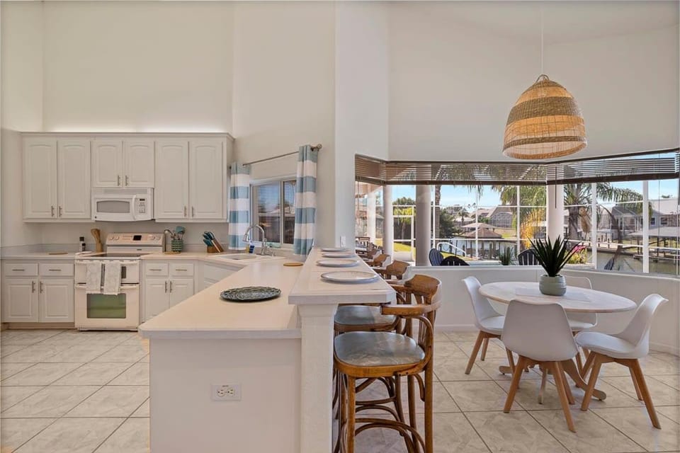 Luxury 4-Bedroom Canal Home with Pool House in Palm Coast