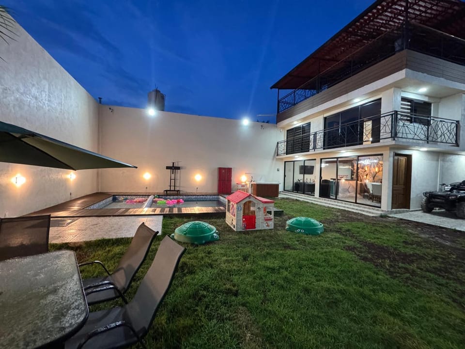 Property building, Patio, Night, Garden, Garden view, Swimming pool
