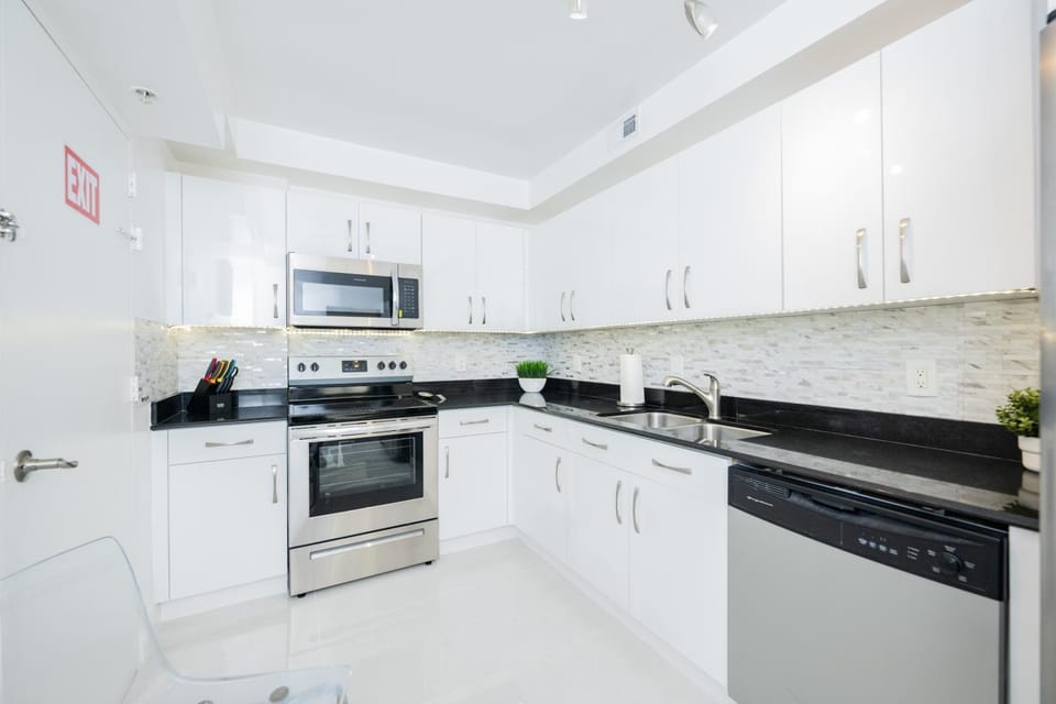 Kitchen or kitchenette, dishwasher, microwave, oven, stove, kitchen