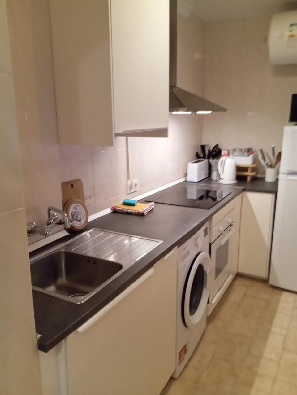Kitchen or kitchenette, oven, stove, toaster, washing machine