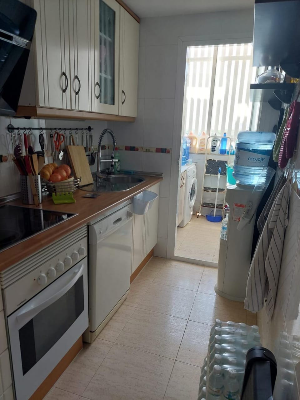 Kitchen or kitchenette, dishwasher, oven, stove