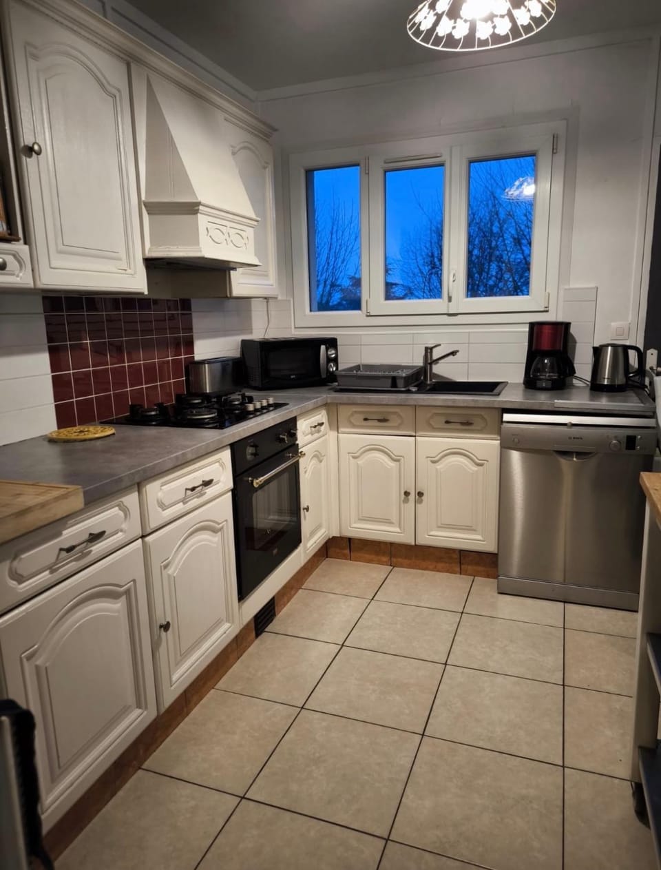 Kitchen or kitchenette, dishwasher, oven, stove
