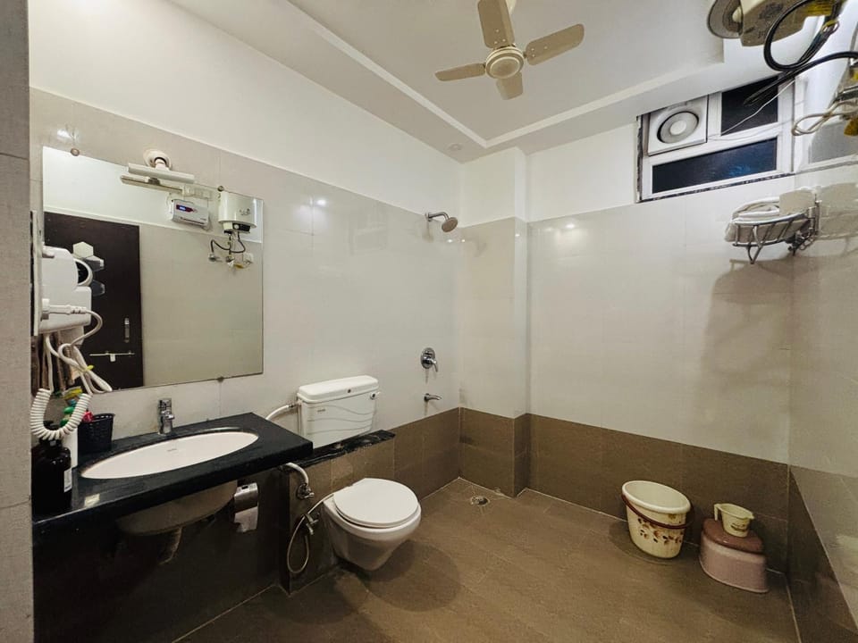 Toilet, Bathroom, hair dryier, towels