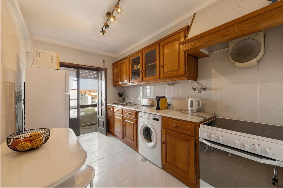 Kitchen or kitchenette, oven, stove, washing machine