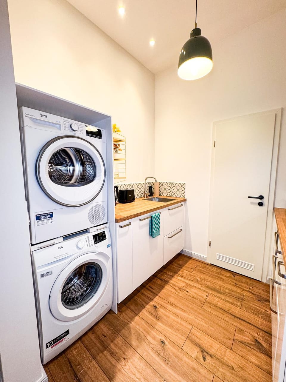 Kitchen or kitchenette, dishwasher, washing machine, dryer
