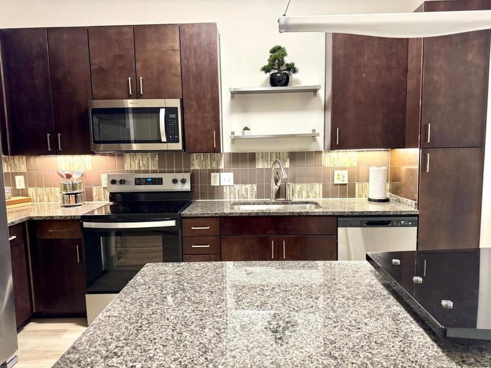 Kitchen or kitchenette, dishwasher, oven, stove, toaster