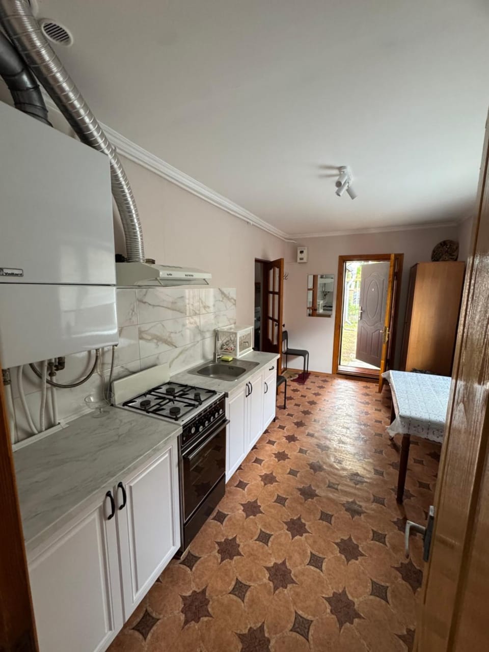 Kitchen or kitchenette, stove