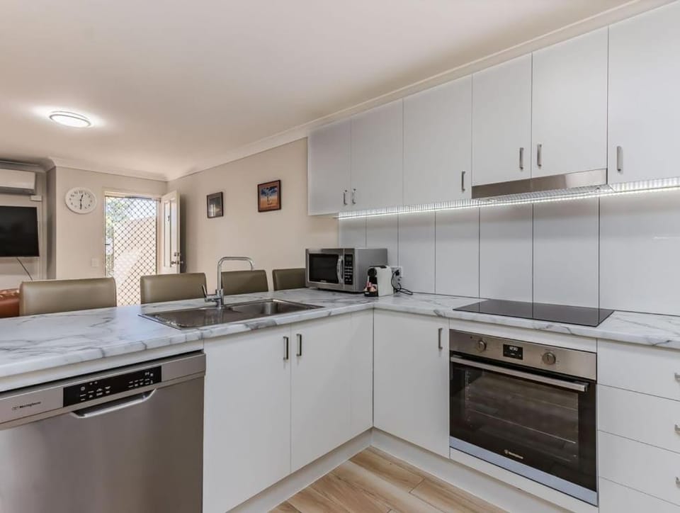 Kitchen or kitchenette, dishwasher, oven, stove, toaster