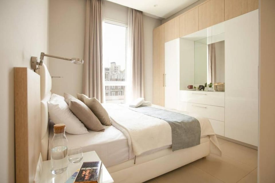 Bed, towels, wardrobe, air conditioner