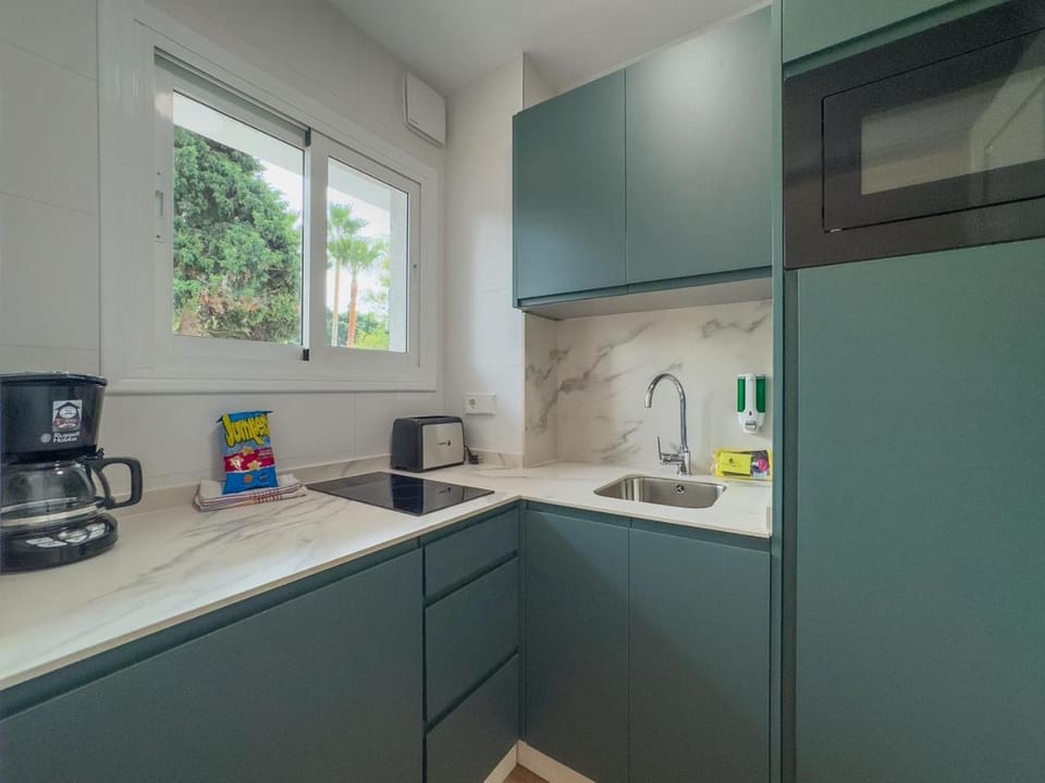 Kitchen or kitchenette, stove, toaster