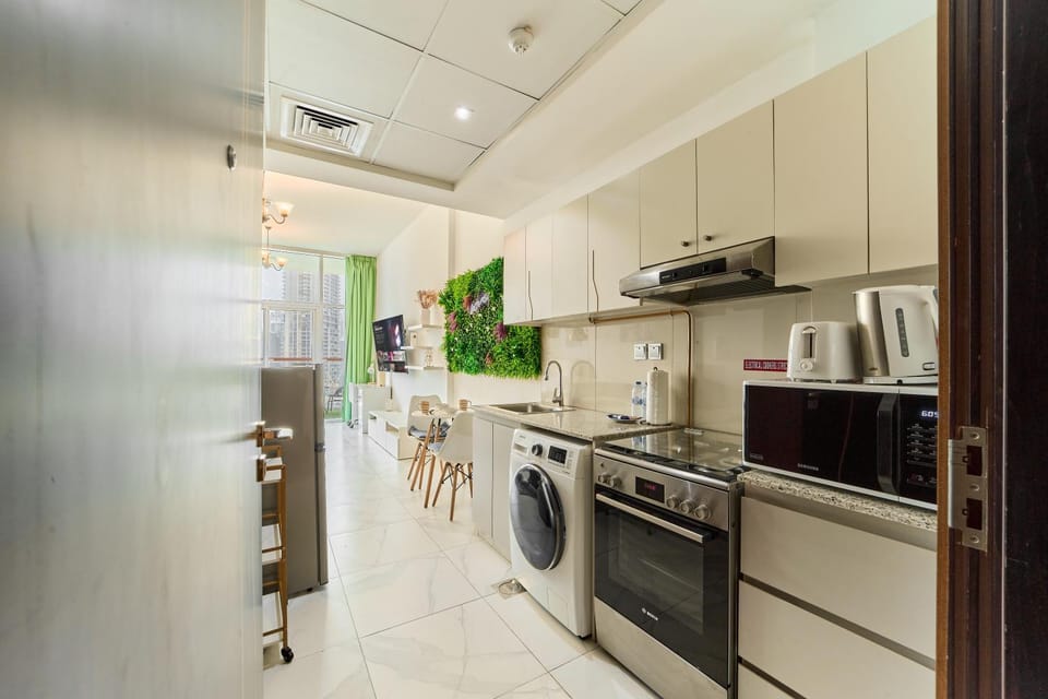 Kitchen or kitchenette, oven, stove, toaster, washing machine