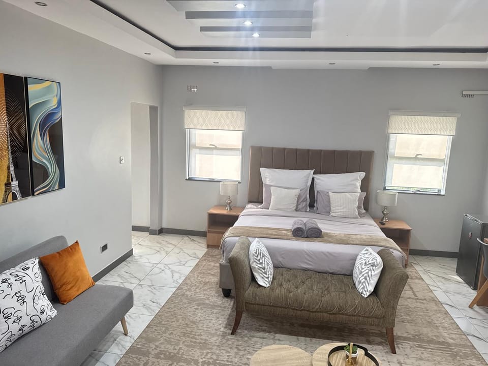 Property building, Bed, Seating area, Bedroom, Swimming pool