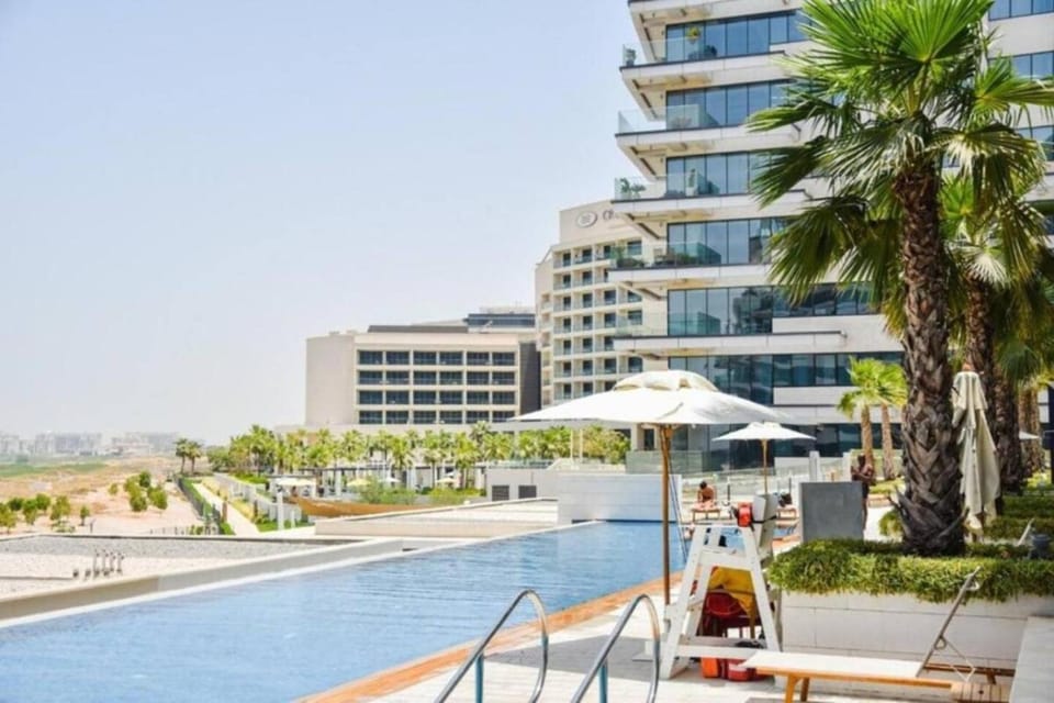 Property building, Day, Pool view, Swimming pool, sunbed