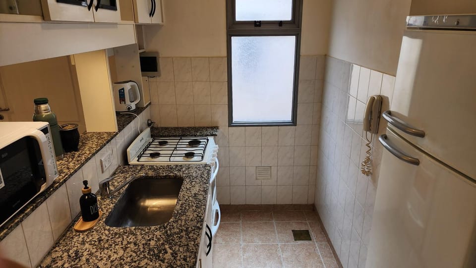 Kitchen or kitchenette, dishwasher, oven