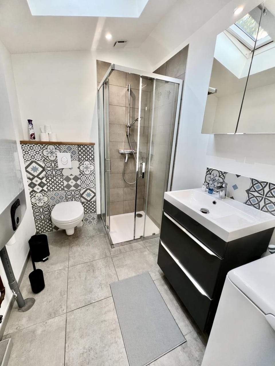 Shower, Toilet, Bathroom, hair dryier, towels, washing machine
