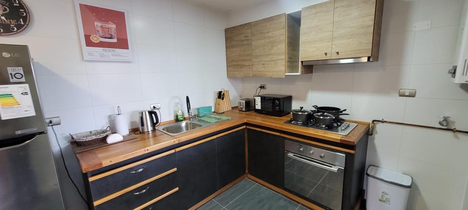 Kitchen or kitchenette, oven, stove, toaster