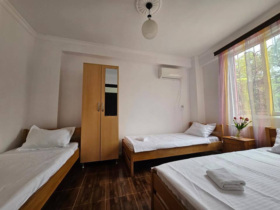 Bed, towels, wardrobe, air conditioner